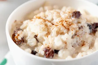Close up view of a bowl of Rice Pudding.